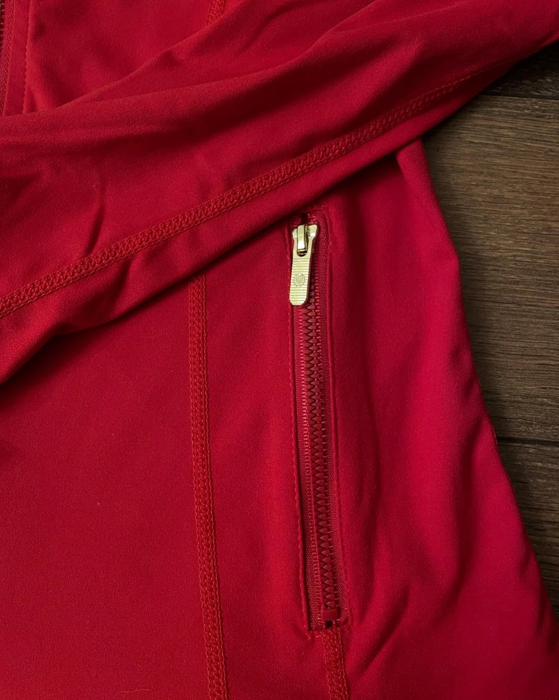 Red lululemon jacket + gold zip