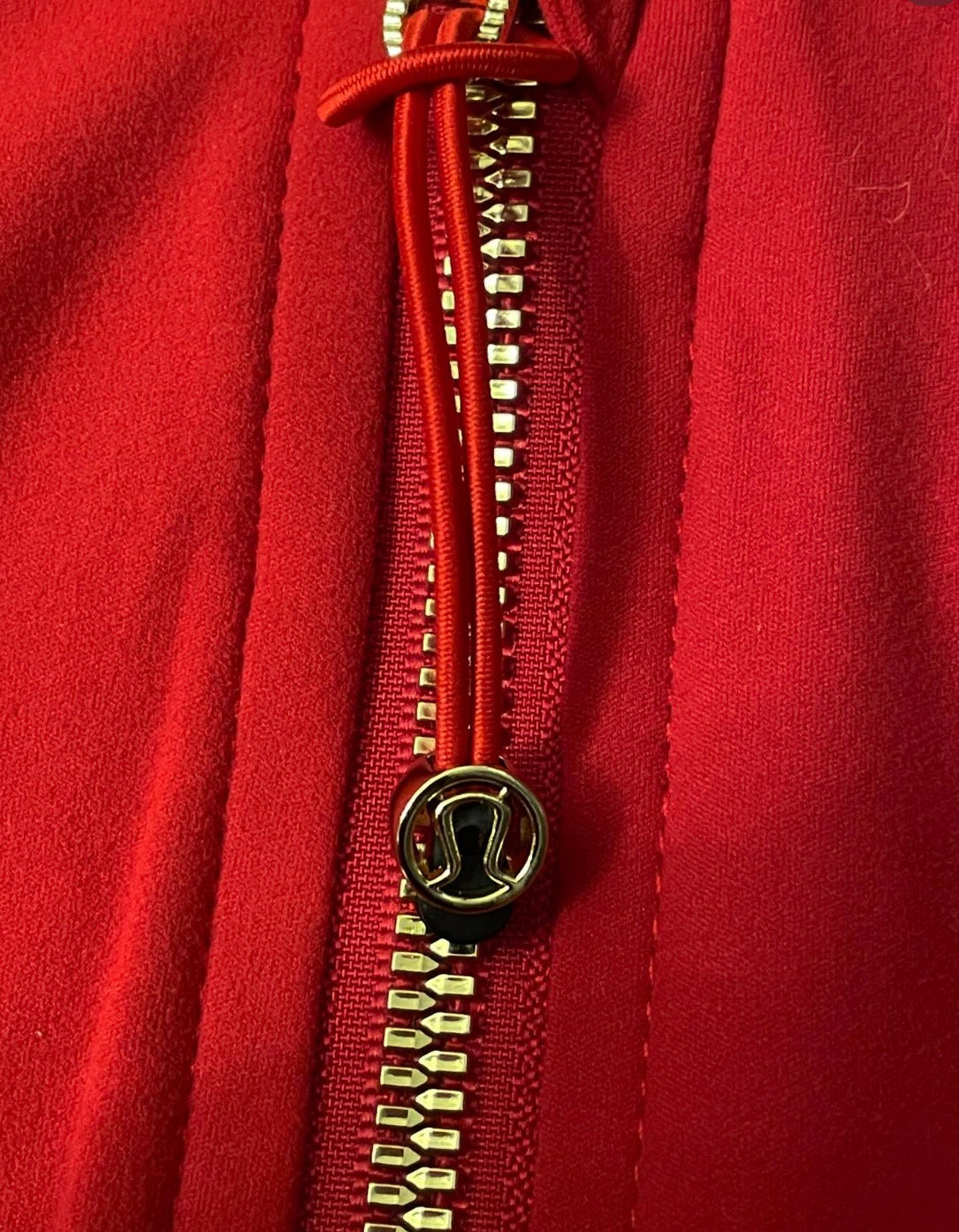Red lululemon jacket + gold zip