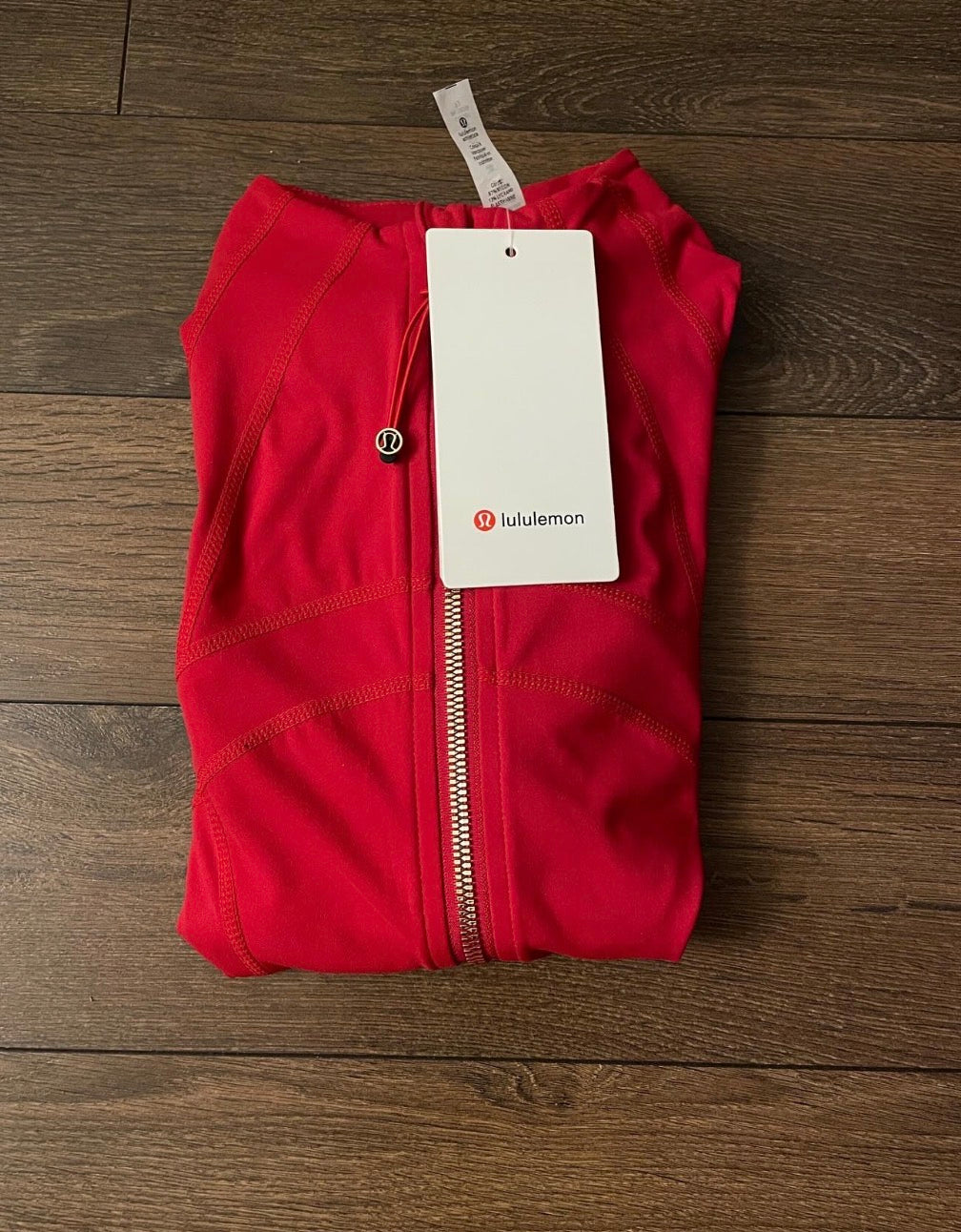 Red lululemon jacket + gold zip