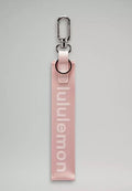 Light pink lululemon keychain