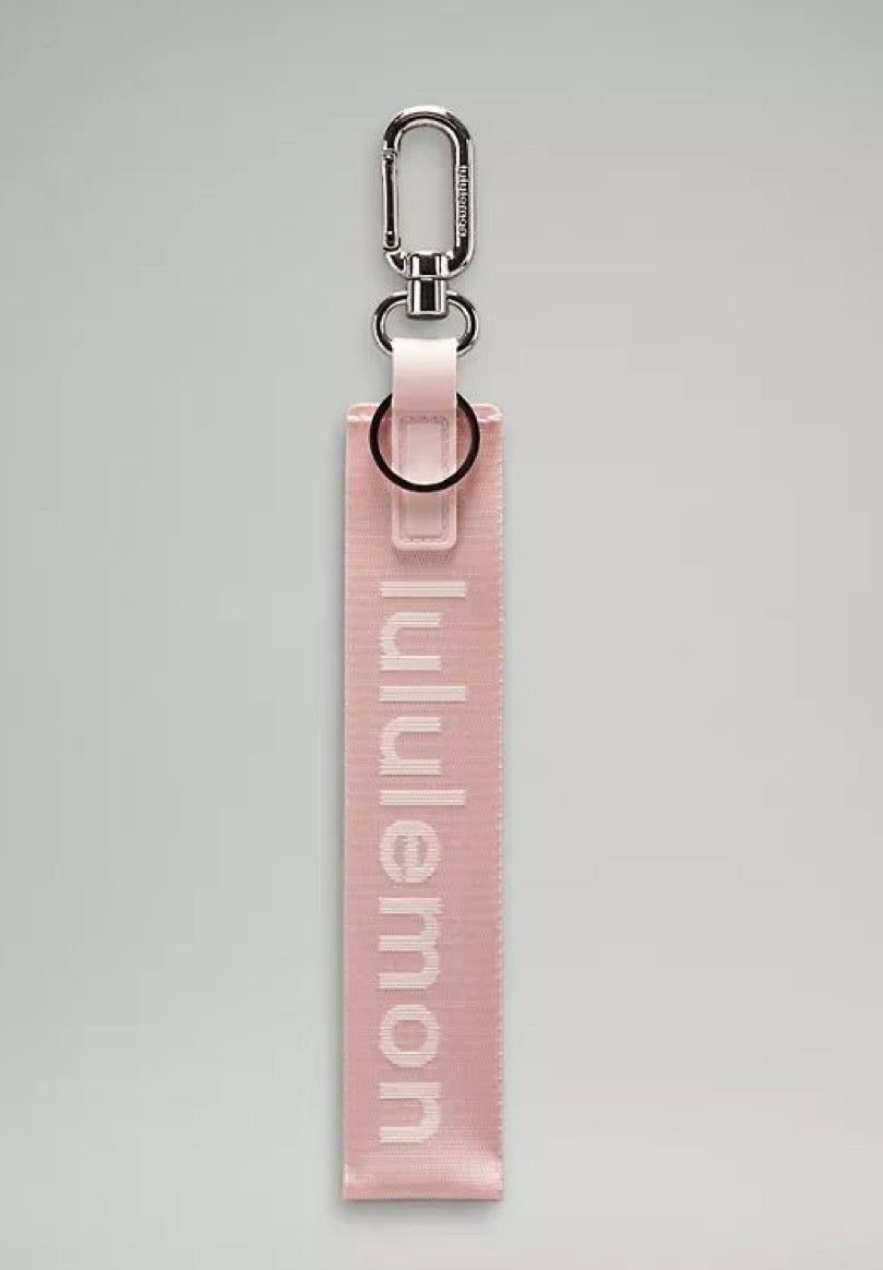 Light pink lululemon keychain