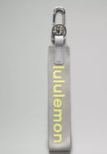 Grey/yellow lululemon keychain